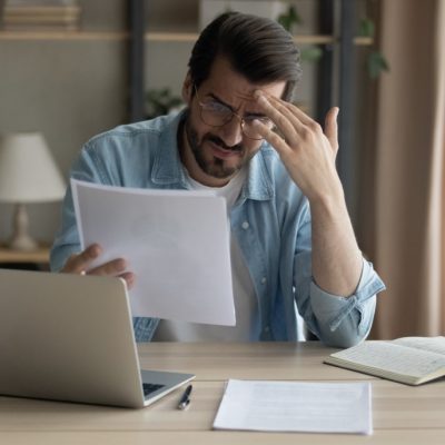 Confused,Shocked,Self,Employed,Businessman,Holding,Paper,Letter,Informing,About